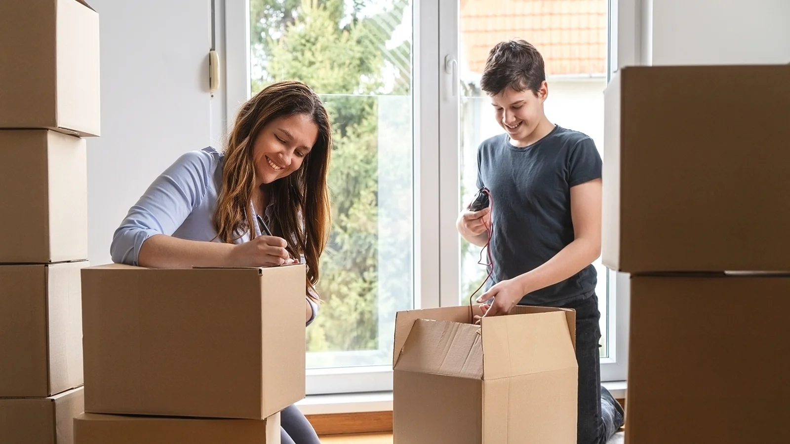 a mother and son preparing for relocation